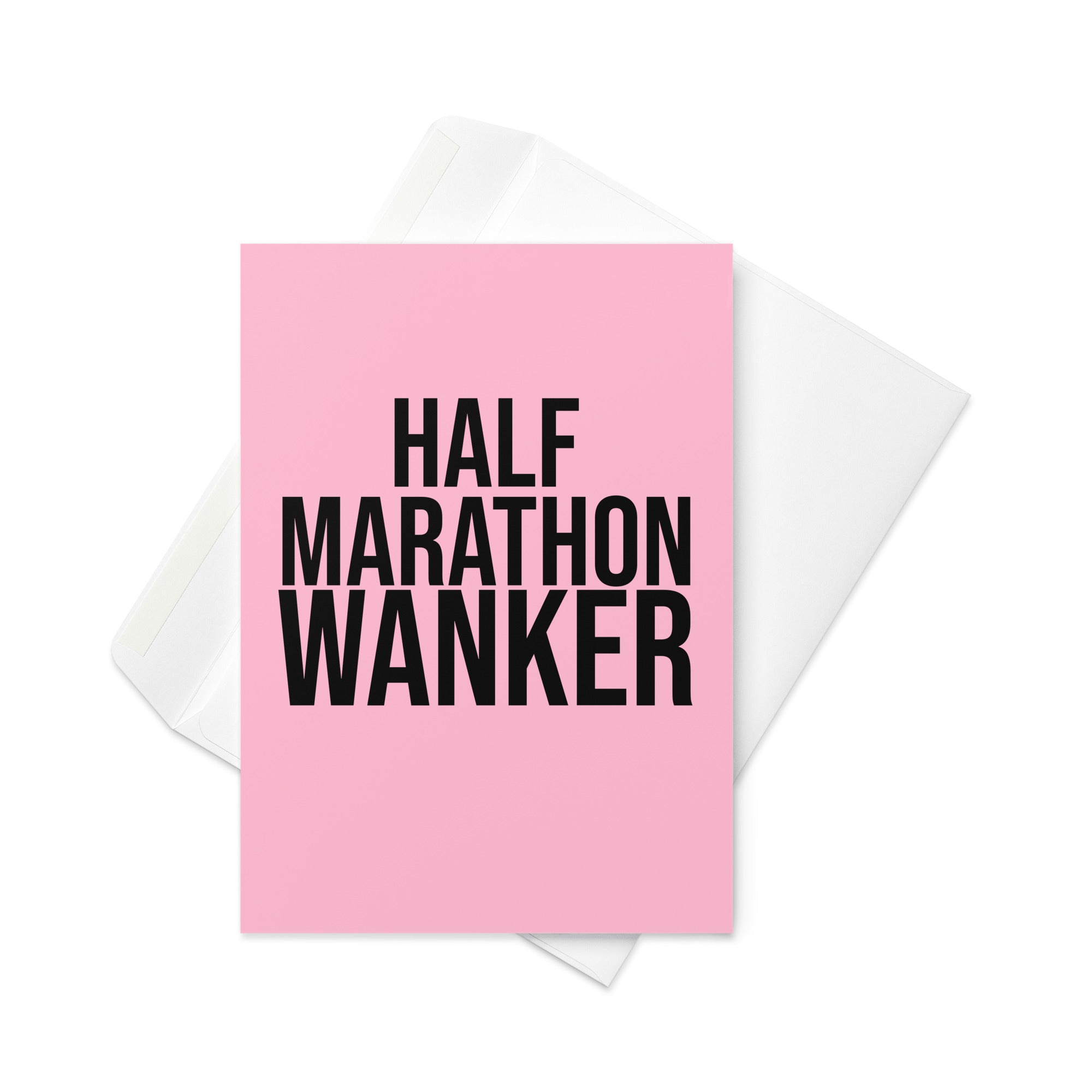 pink greetings card with bold black font reading half marathon wanker. a gift card for someone who has trained for and completed a half marathon race 