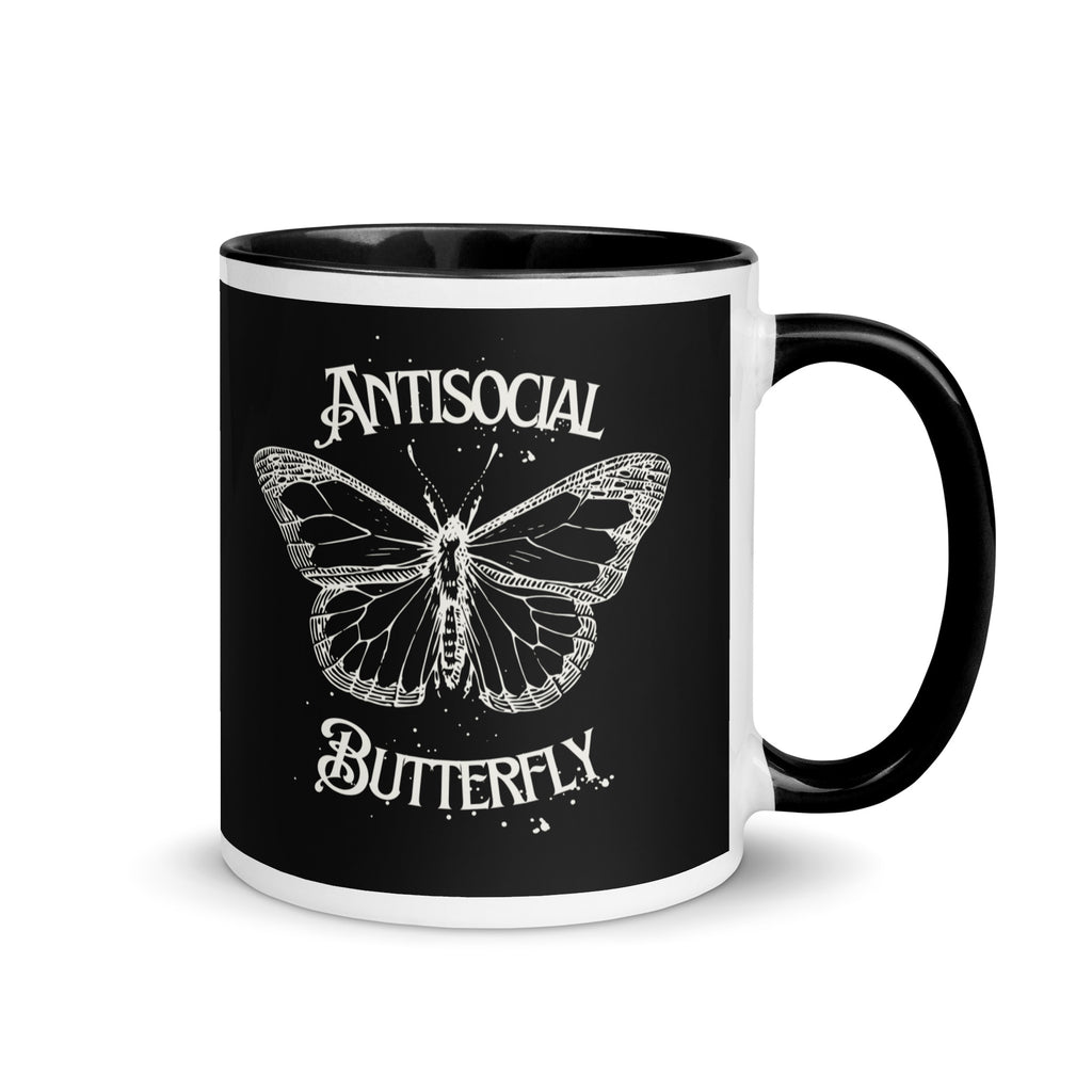 Black ceramic mug with gothic style white text reading “Antisocial Butterfly,” perfect gift for introverts, coffee lovers, or fans of gothic aesthetic drinkware.