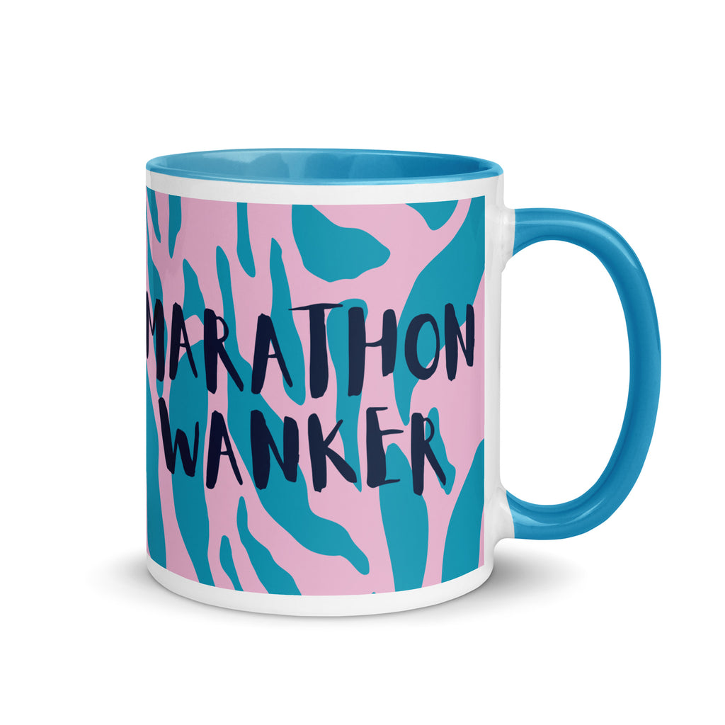Marathon wanker mug with blue inside and handle, with a pink and blue animal print background and the words marathon wanker in a fun, bold font. 