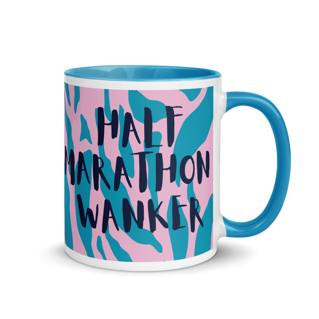 Half Marathon wanker mug with blue inside and handle, with a pink and blue animal print background and the words half marathon wanker in a fun, bold font. 