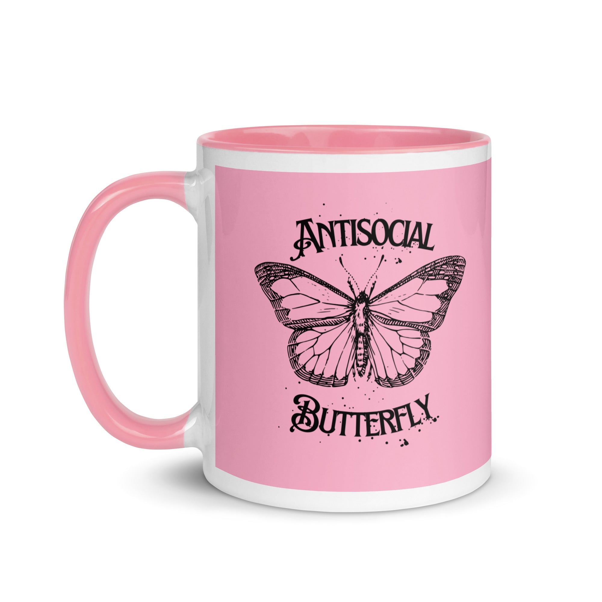 Pink ceramic mug with black gothic style text reading “Antisocial Butterfly,” perfect for introverts or gothic coffee lovers.