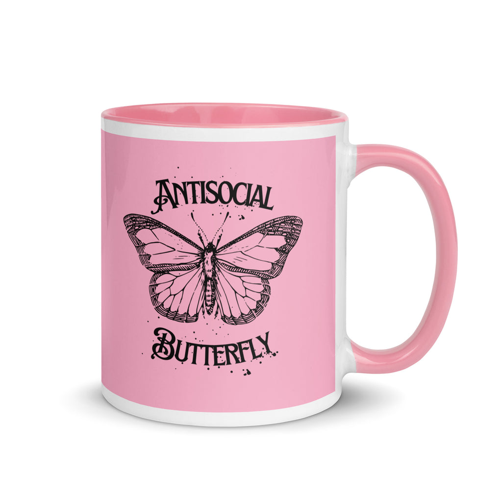Pink ceramic mug with black gothic style text reading “Antisocial Butterfly,” perfect for introverts or gothic coffee lovers.