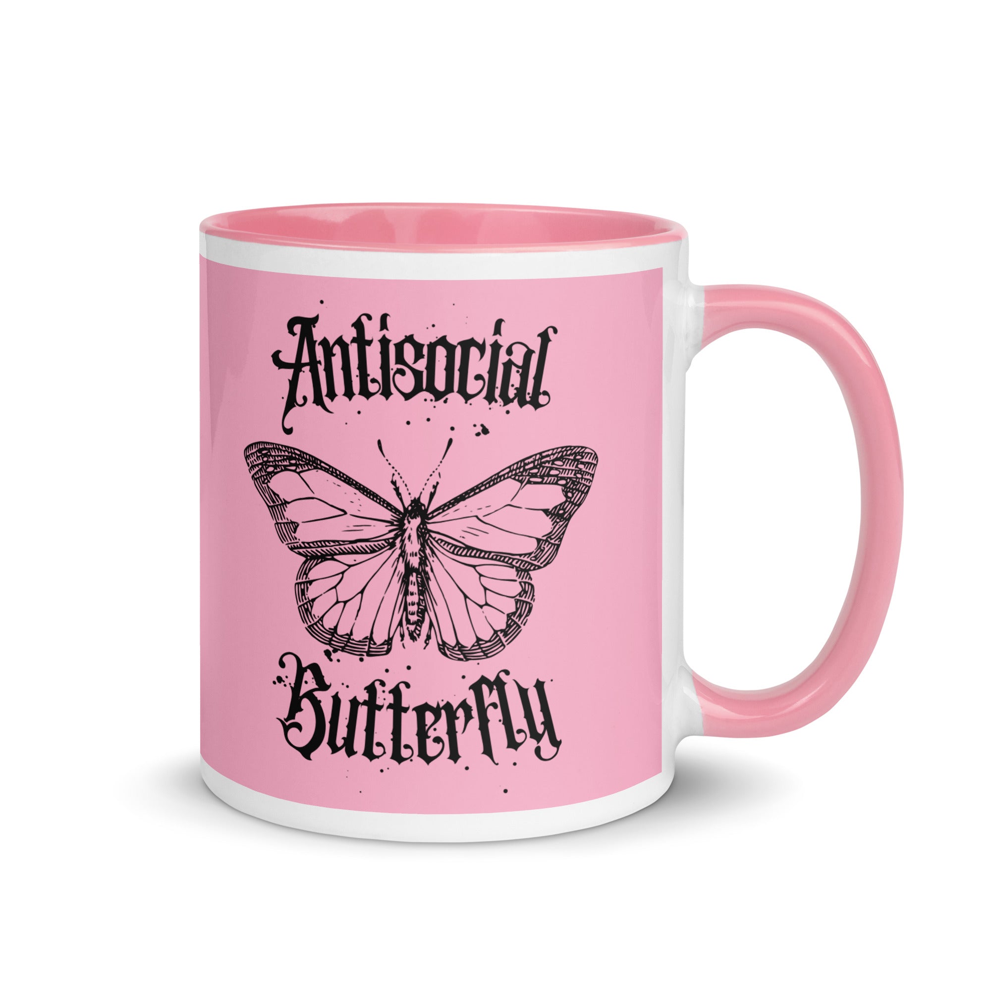Pink ceramic mug with black gothic style text reading “Antisocial Butterfly,” perfect for introverts or gothic coffee lovers.