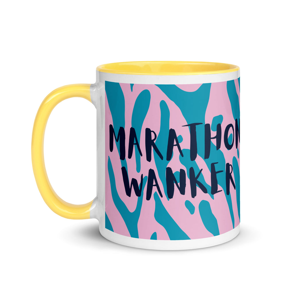 Marathon wanker mug with yellow inside and handle, with a pink and blue animal print background and the words marathon wanker in a fun, bold font. 