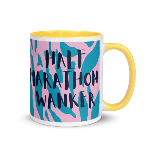 Half Marathon wanker mug with yellow inside and handle, with a pink and blue animal print background and the words half marathon wanker in a fun, bold font. 